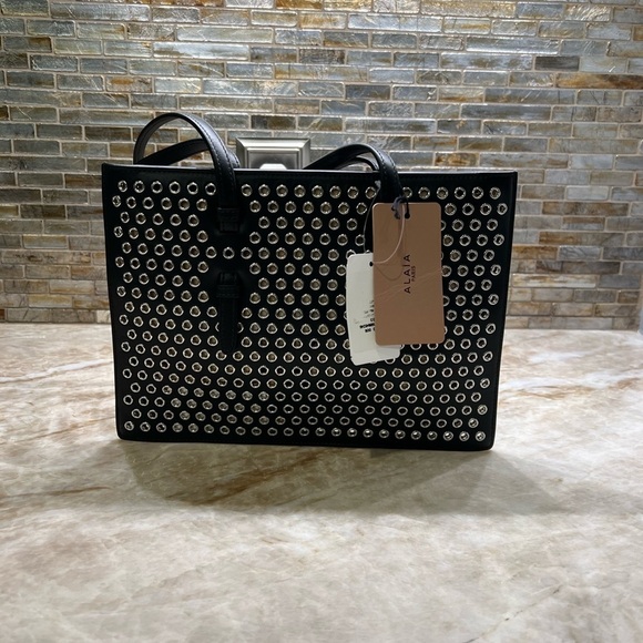 ALAÏA Mina Small perforated leather tote bag - Picture 10 of 14
